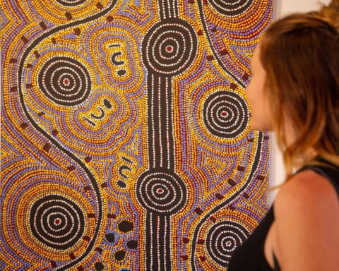 A Girl looking at Aboriginal Art