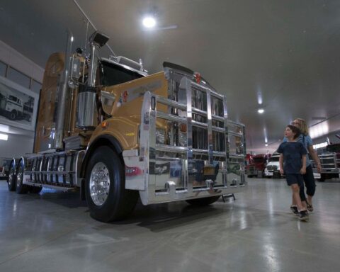 A boy and his mum enjoying the Road Transport Hall of Fame in Alice Springs