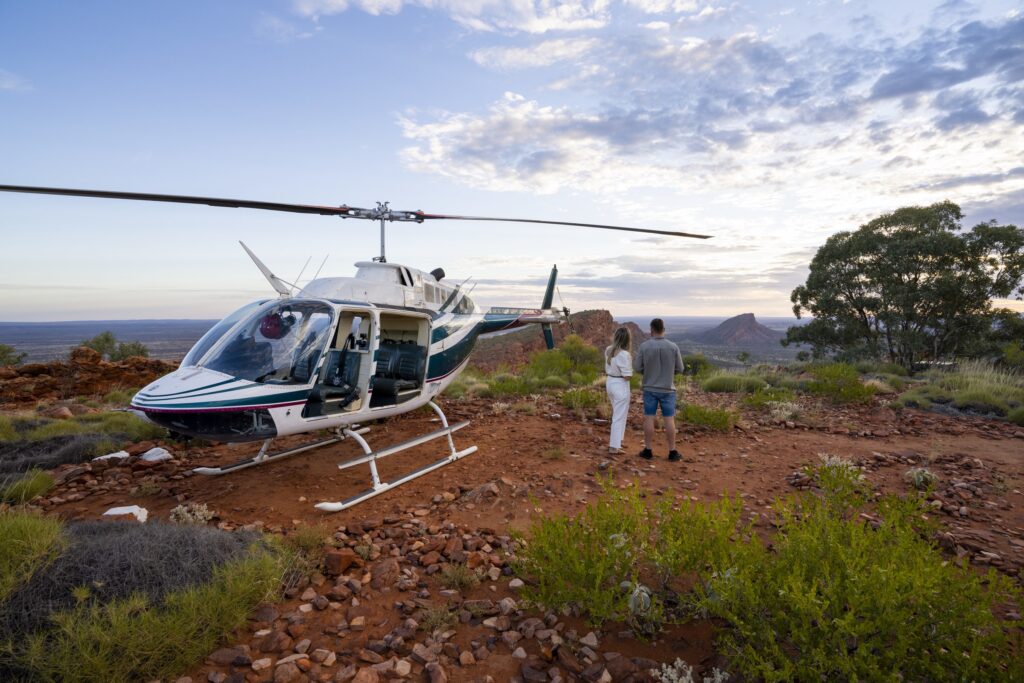 Alice Springs Helicopters with a couple looking at the view 