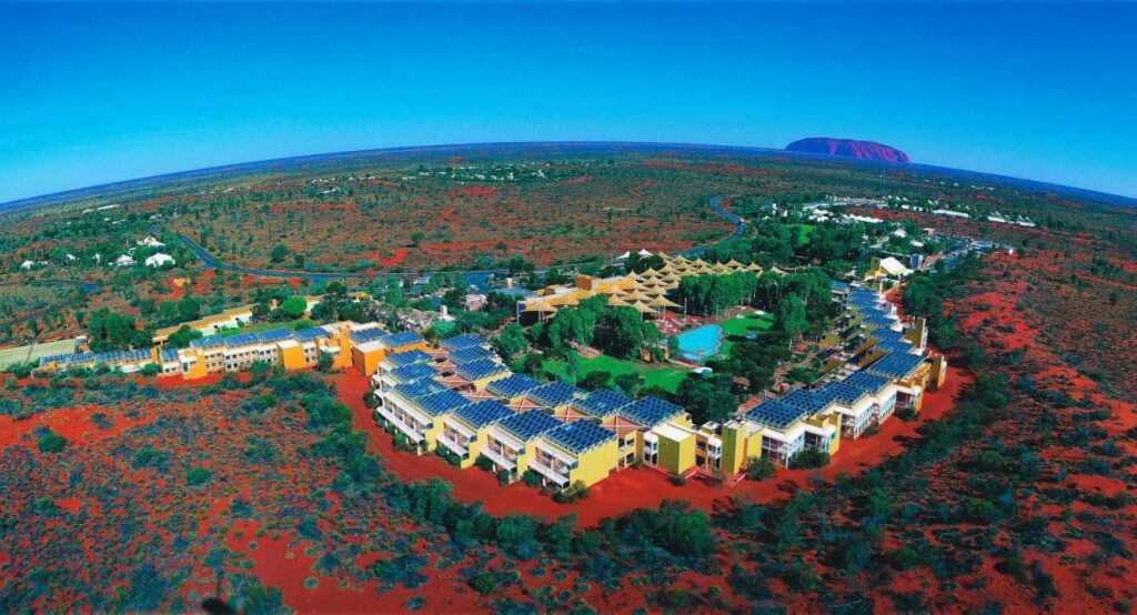 Ariel view of Ayers rock resort with Uluru in back ground