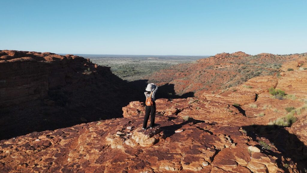 Feel on top of the world as you walk along the towering red rock cliffs of Kings Canyon and take in views of the forest of palms below.

Watarrka National Park is only three hours?? drive from Uluru, and is home to the mighty Kings Canyon – a majestic destination featuring 300m high sandstone walls, palm-filled crevices, and views that stretch across the desert.

More than just a day trip destination, Watarrka National Park has a range of walking trails, 4x4 tracks, camel tours and accommodation options ranging from camping to resort-style rooms.