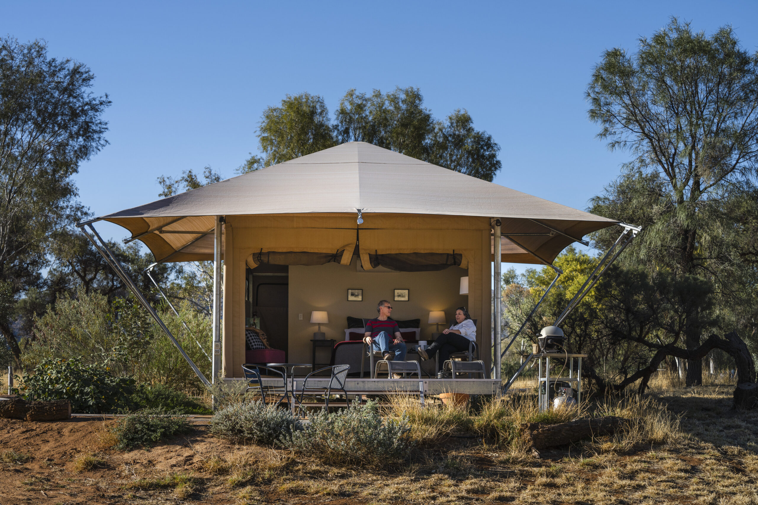 Enjoy the colours of Central Australia's scenery, birdlife, sunsets and night sky from the front deck of this Luxury Boutique Tent. Squeakywindmill Boutique B&B is situated on the edge of the iconic Western MacDonnell Ranges, with a sumptuous bed that takes in the views, your own BBQ, kitchenette, ensuite and deck. Enjoy a campfire under the twinkling stars of the southern cross, an essential outback experience.