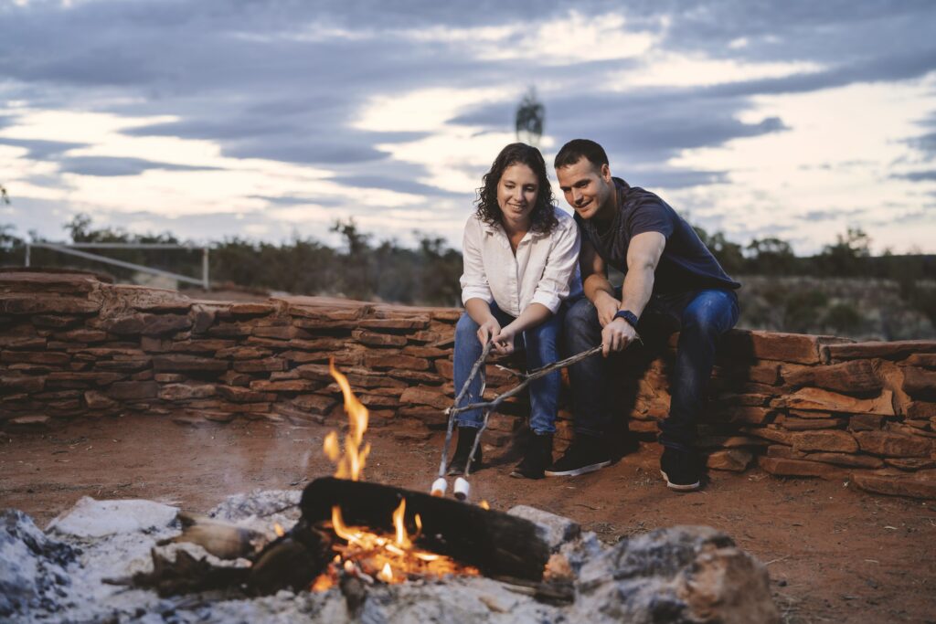 A Couple Enjoying a Camp Fire at Kings Creek Station 